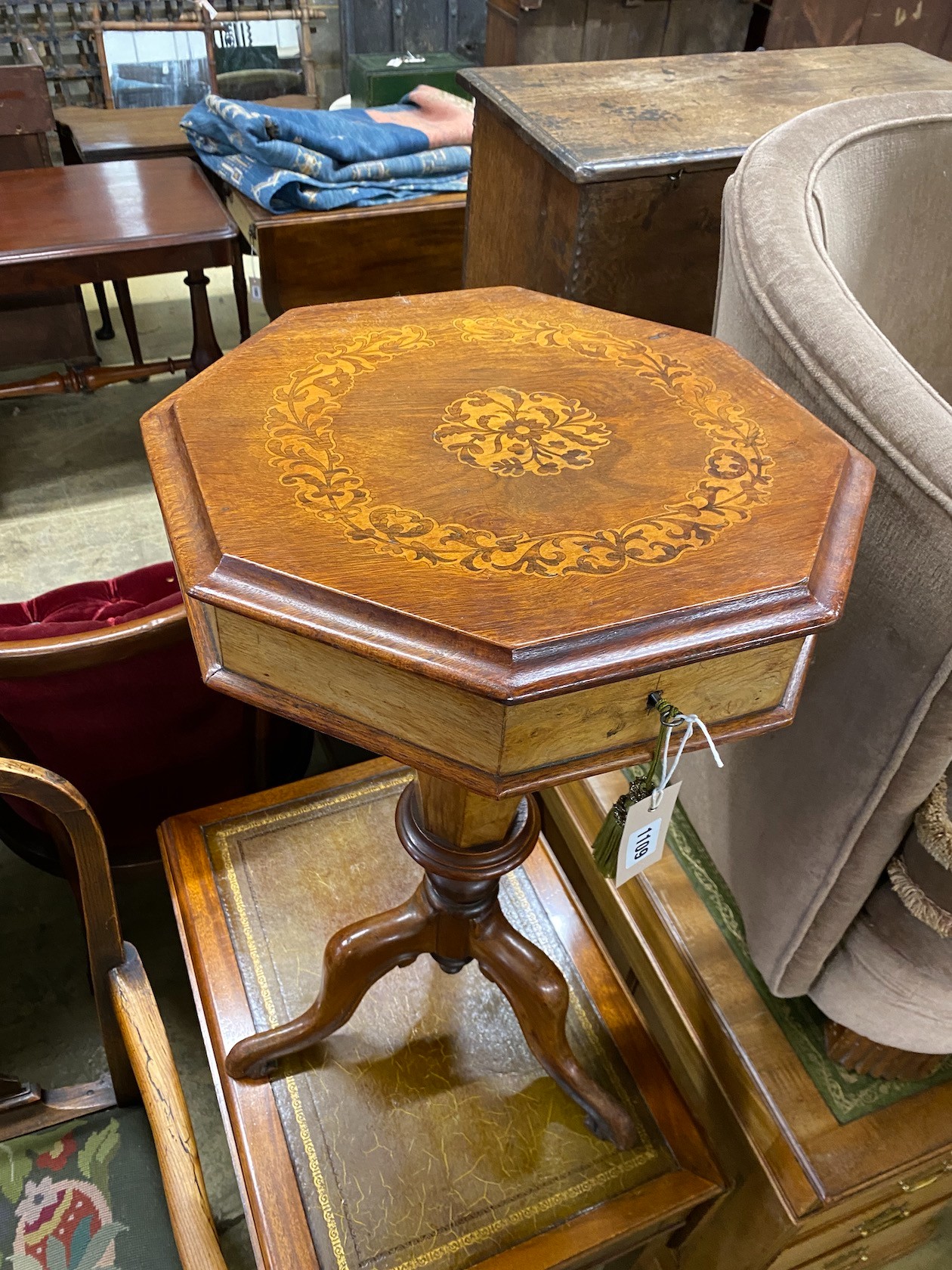 A Victorian marquetry inlaid octagonal trumpet work table, width 40cm, height 70cm